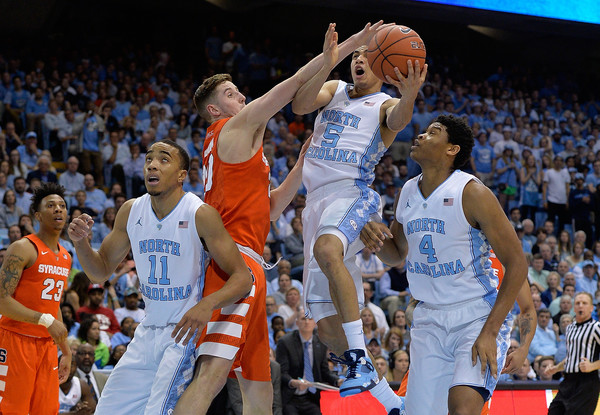 Marcus Paige gets fouled driving to the basket against Syracuse