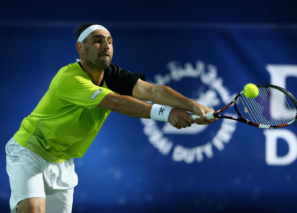 Marcos Baghdatis attempts a double-handed backhand