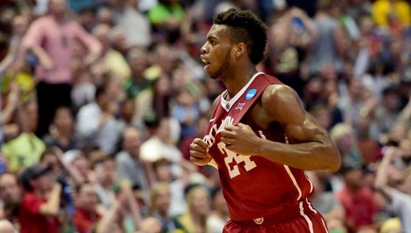 Hield holding up jersey