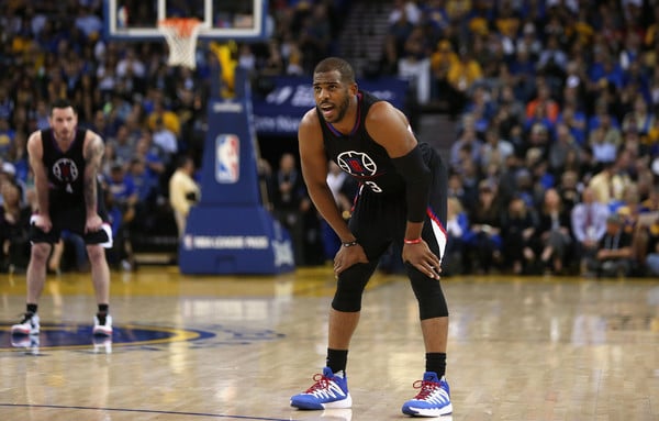Chris Paul taking a rest while play is stopped
