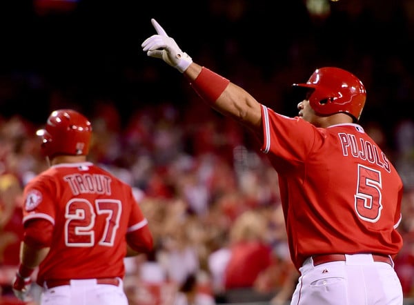 Mike Trout and Albert Pujols score after a two-run homer by the latter against Seattle