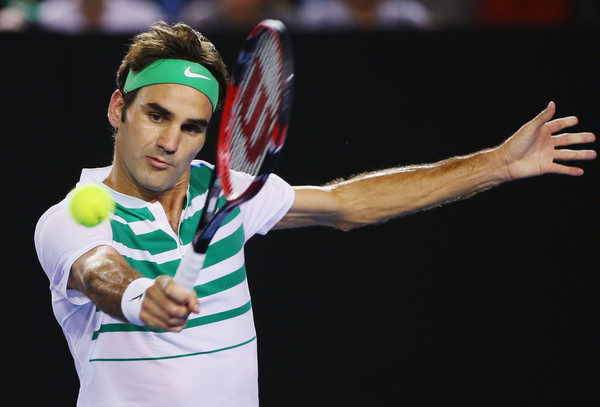Roger Federer plays a backhand against Novak Djokovic in the semifinals of the Australian Open