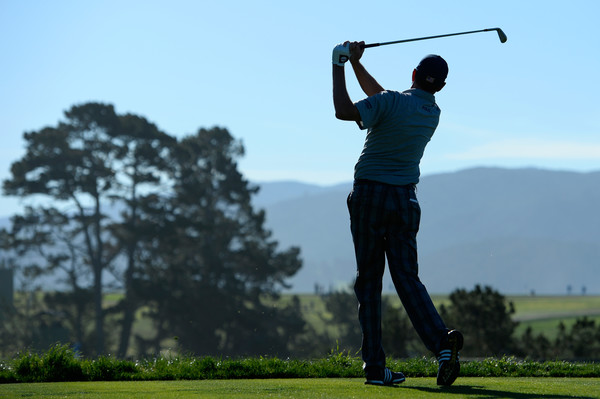 Davis Love III looks on after teeing off at Pebble Beach