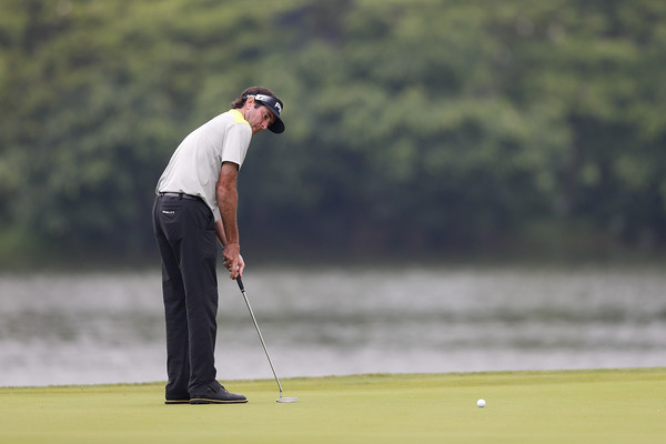 Bubba Watson takes a putt at the Shenzhen International