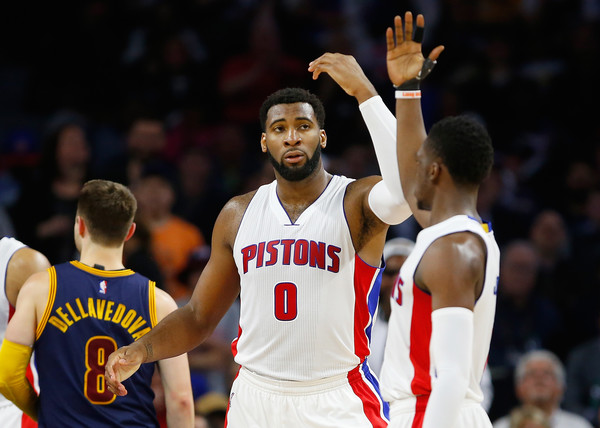 Andre Drummond and Reggie Jackson celebrate after a bucket