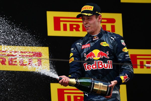 Daniil Kyvat celebrates his third-place win at the Chinese Grand Prix