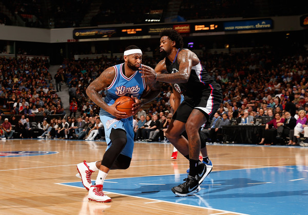 DeMarcus Cousins attempts to drive against DeAndre Jordan