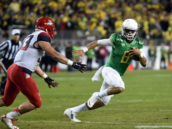Scooby Wright III chases after Marcus Mariota then of the Oregon Ducks