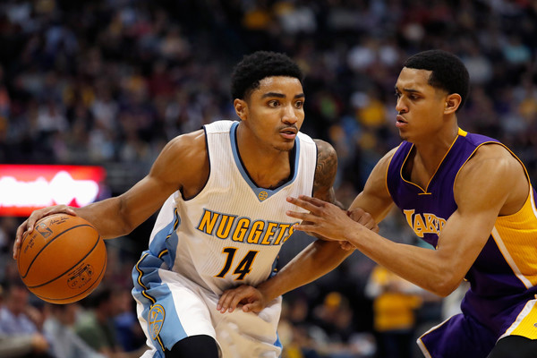 Gary Harris tries to drive past Jordan Clarkson of the Los Angeles Lakers
