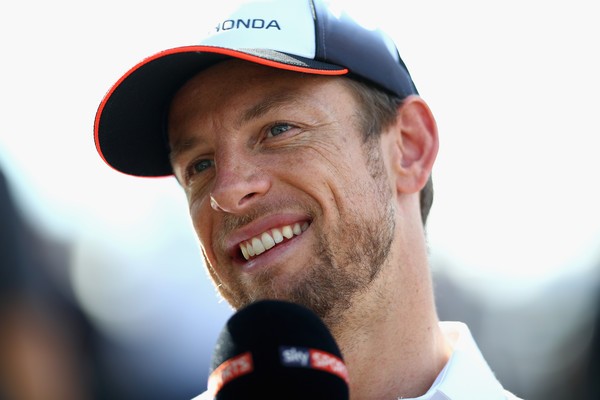Jenson Button talks with reporters before the big race
