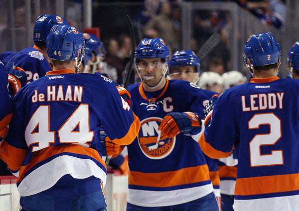 John Tavares celebrates with teammates after hitting a goal