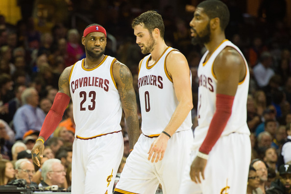 Kevin Love, Kyrie Irving and LeBron James walk off the hardcourt