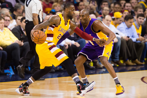 LeBron James trying to go past Kobe Bryant of the Los Angeles Lakers
