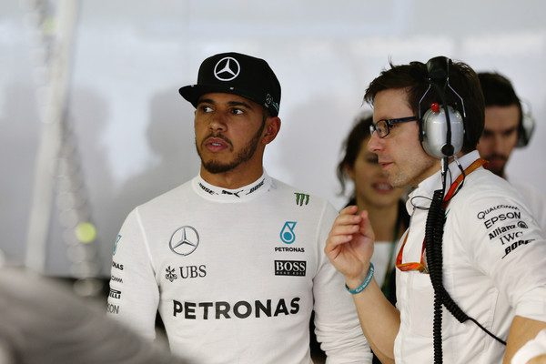 Lewis Hamilton discusses his gameplan with a Mercedes engineer