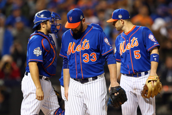 Matt Harvey looks down after being relieved in the ninth frame against the Kansas City Royals