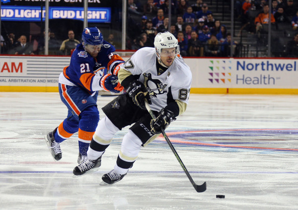 Sidney Crosby skating against the New York Islanders in a regular season game