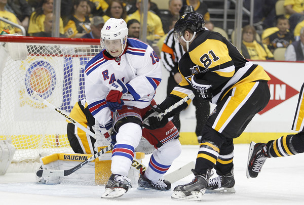 Jesper Fast and Phil Kessel involved in a goal-line scrum in Game 1