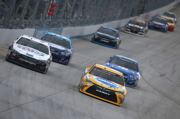 Kyle Busch leading a pack of cars at the AAA 400 Drive for Autism at Dover