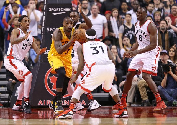 LeBron James goes up against four Toronto defenders