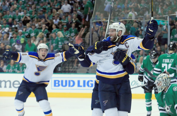 David Backes raises his arms after scoring