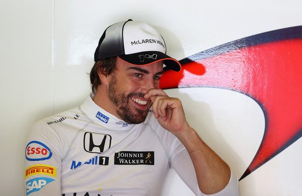 Fernando Alonso talks to the media