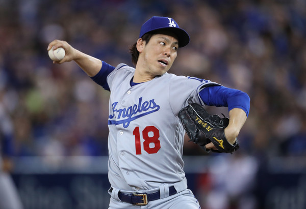 Kenta Maeda throws a pitch against Toronto