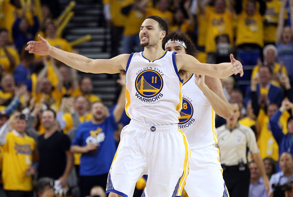 Klay Thompson and Anderson Varejao happy on the court