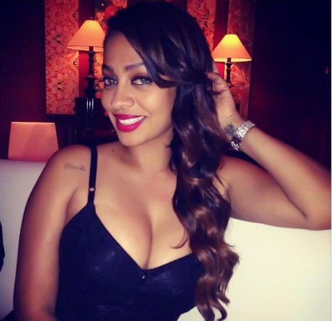 Lala Anthony on the sofa