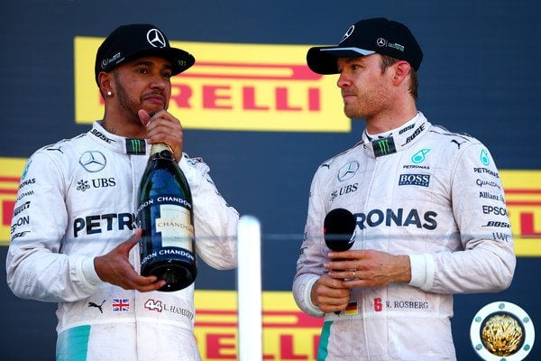Nico Rosberg talks with Lewis Hamilton