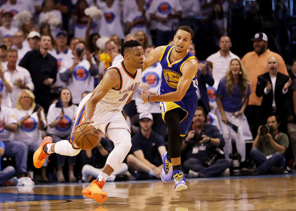 Stephen Curry guards Russell Westbrook