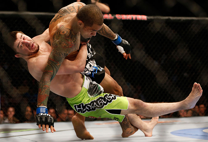 Rustam Khabilov attempts a suplex on Yancy Medeiros