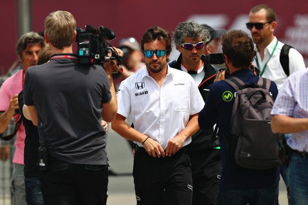 Fernando Alonso surrounded by the press during the Chinese Grand Prix