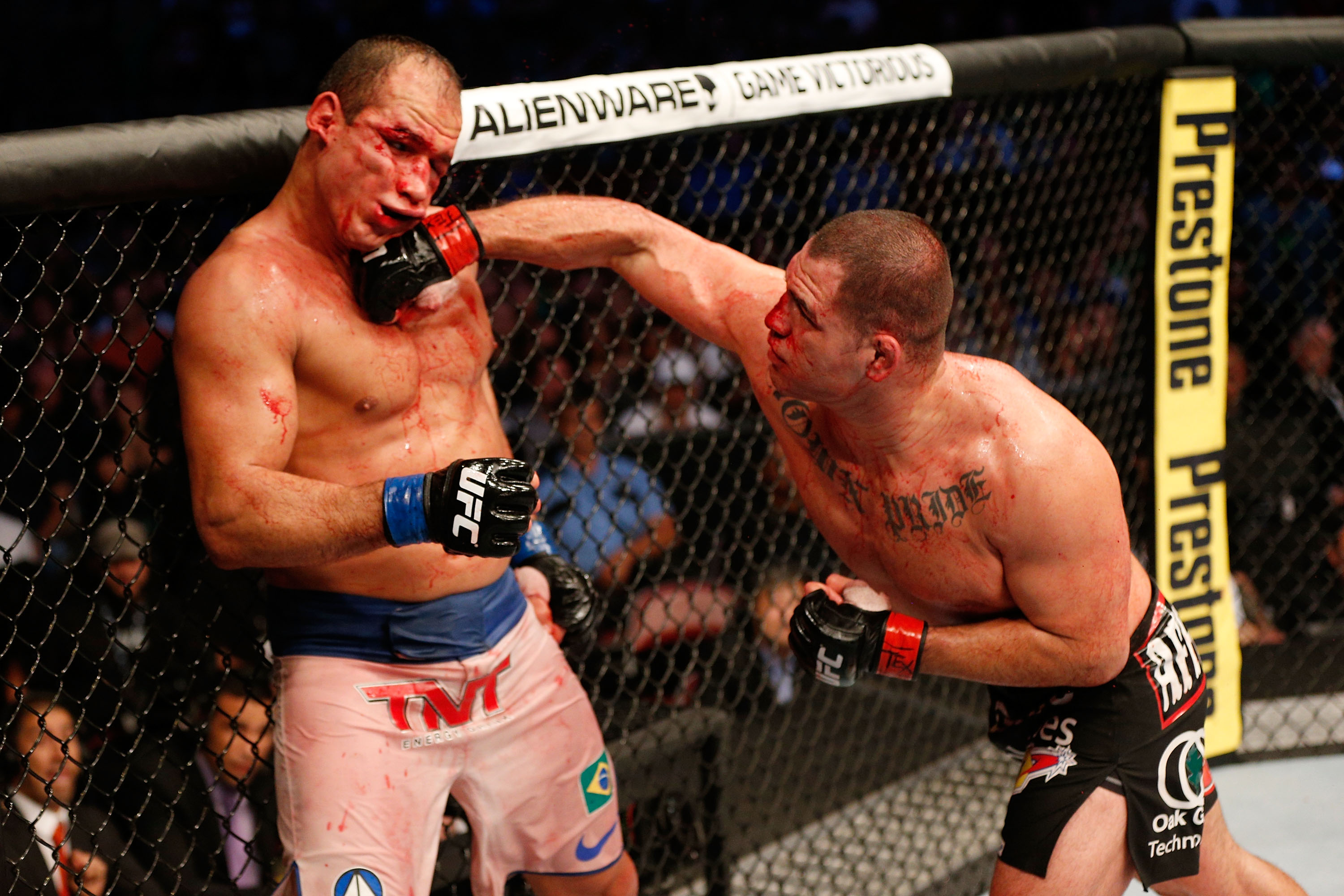 Cain Velasquez lands a right hand on Junior Dos Santos in their third fight.