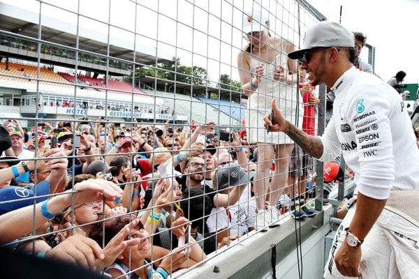 Lewis Hamilton greets the crowd
