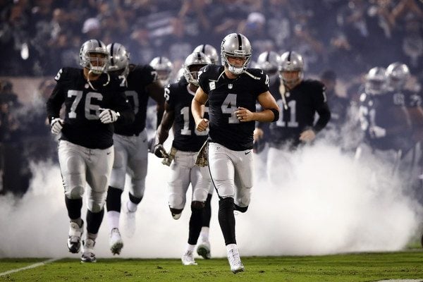 Derek Carr and the rest of the Raiders enter the field